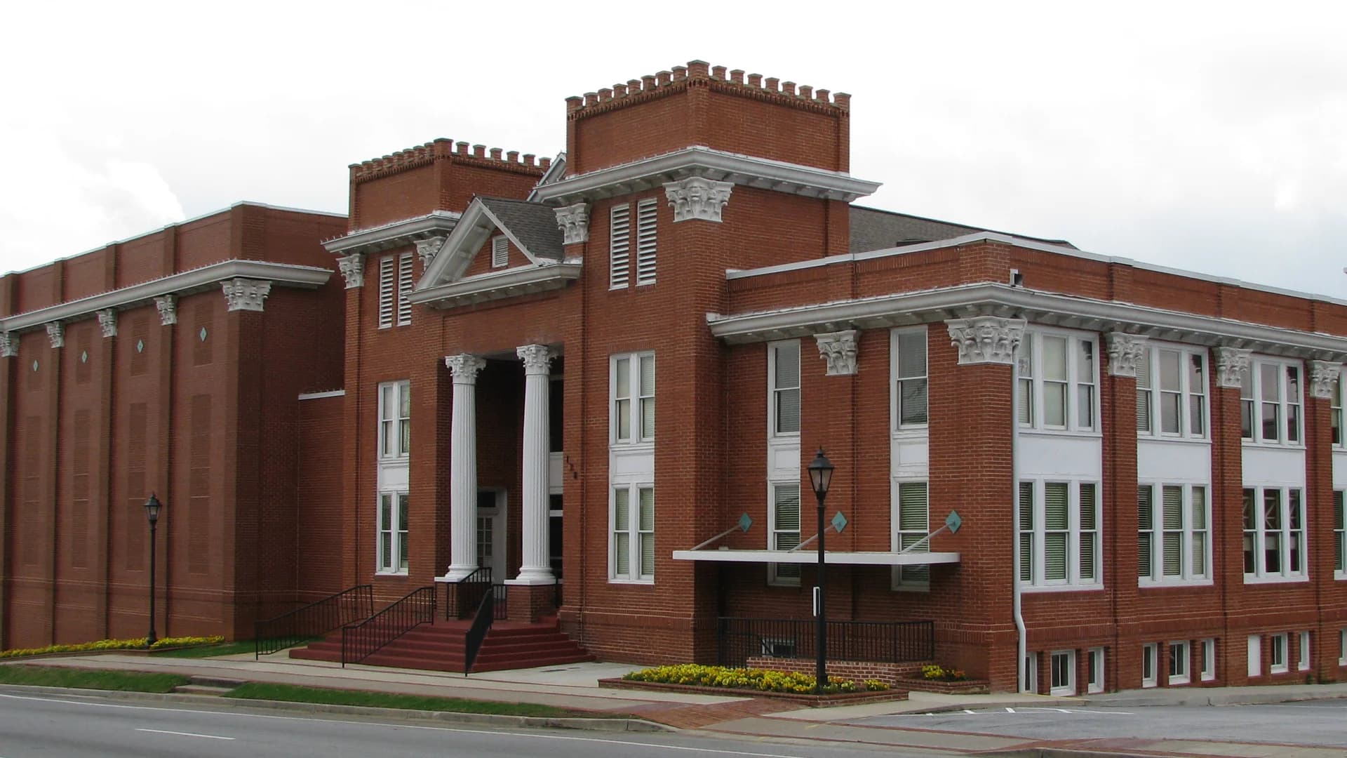 Historic brick Aurora Theatre facade on Pike Street in Lawrenceville, Georgia.