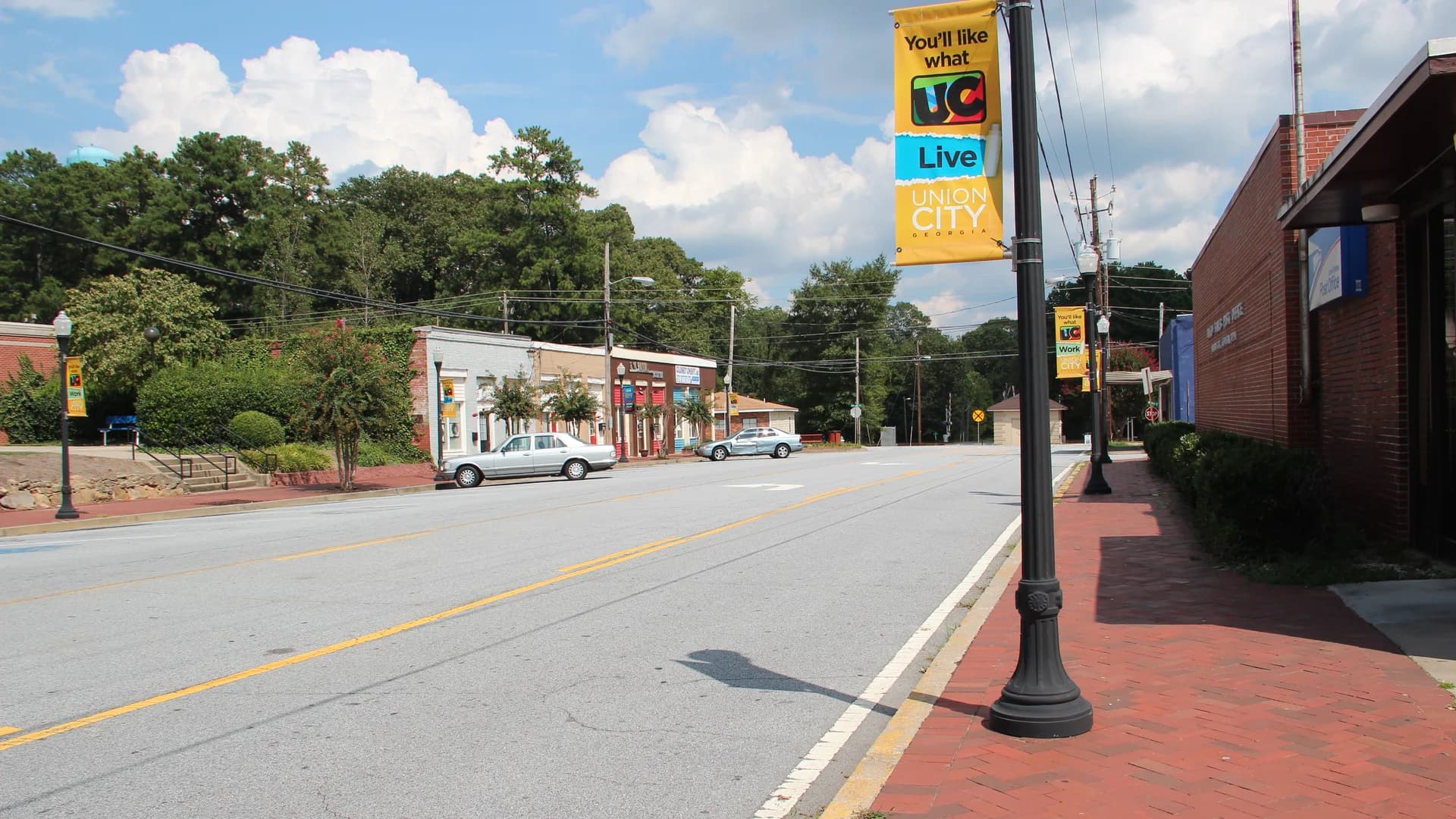 Downtown Union City, Georgia, with brick sidewalks, storefronts and a municipal Union City banner.